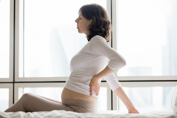 A mom to be suffering from spinal pain