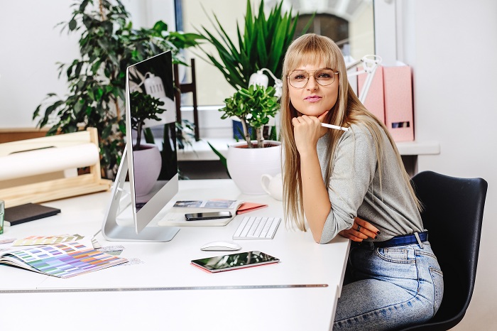 Annoyed woman from sitting all day at work